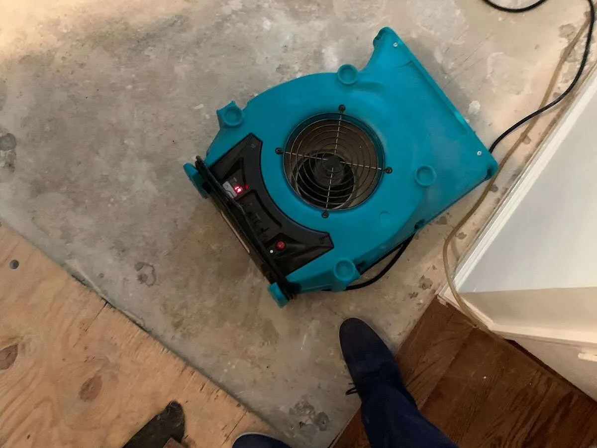 Air mover drying subfloor during Leak Detection & Repair in Atlantic Beach
