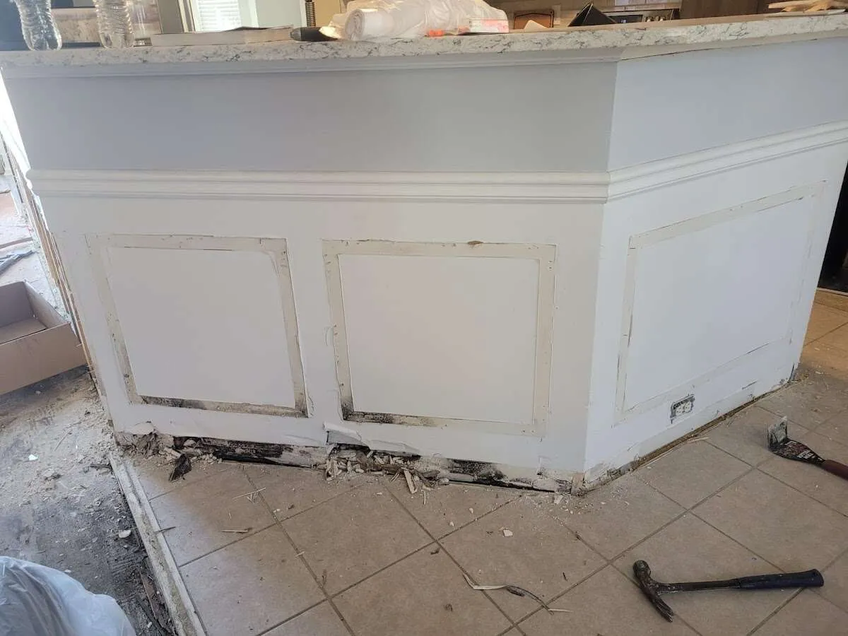 Water damage and mold on kitchen during Sewage Cleanup & Sanitation in Atlantic Beach